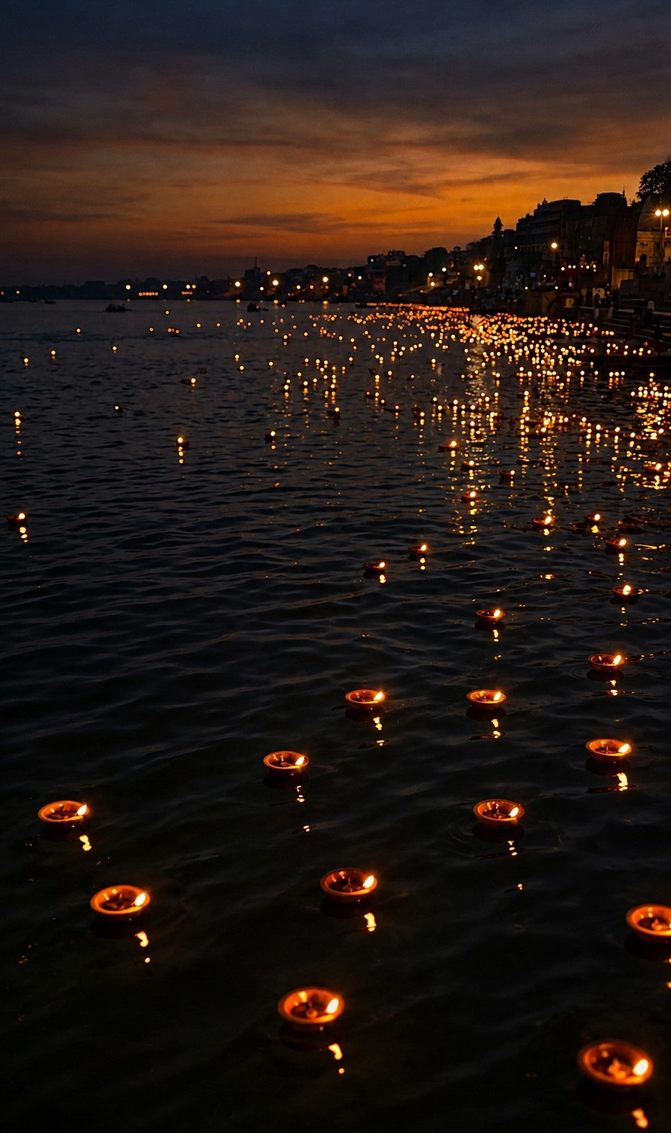 Banaras ghats at dusk, lamps on the Ganga